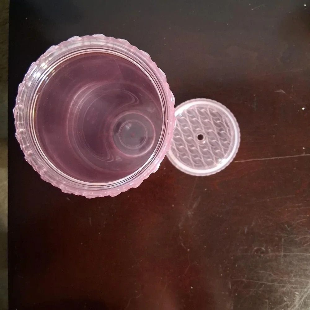 Pink Starbucks tumbler with textured wavy pattern
